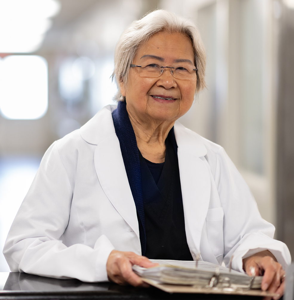 Smiling doctor with paperwork